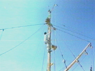 Rigging the aerial mast on MV Kajur